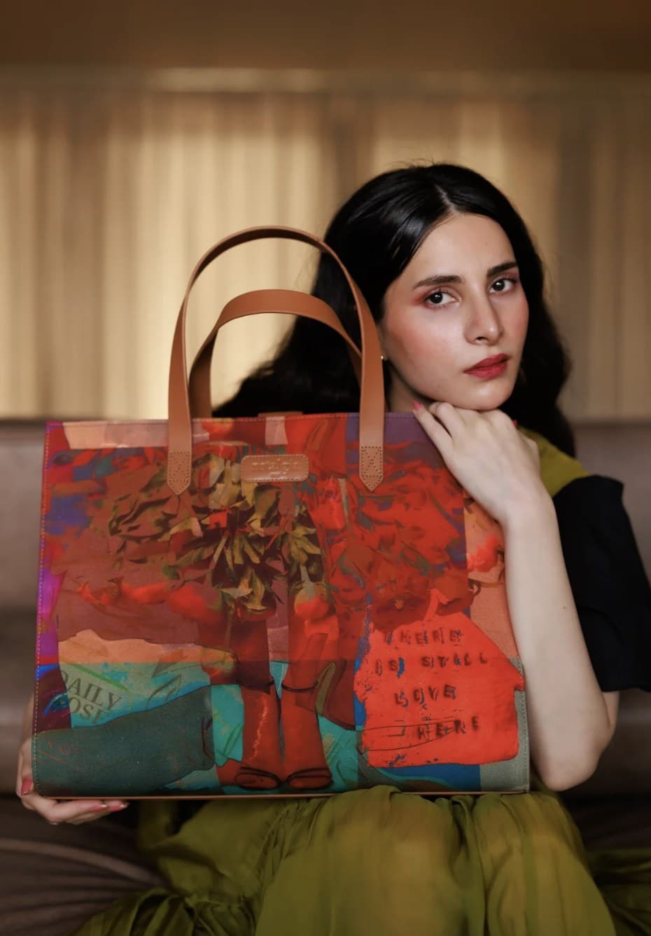 Nstalgia campaign model holding the Andy Warhol x Jean-Michel Basquiat tote