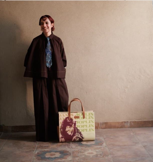 Nstalgia campaign model holding the Janis Joplin tote